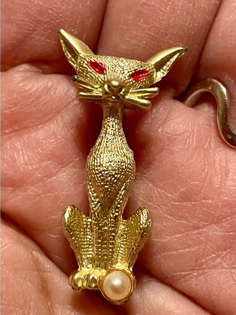 Vintage Gold-Tone Cat Brooch with Red Eyes and Faux Pearl Accent